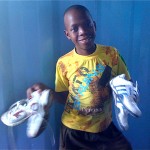 Boy with 2 pairs of shoes