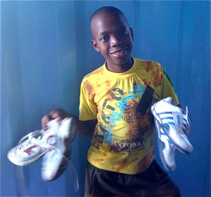 Boy with 2 pairs of shoes