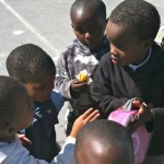 A child proundly showing off a new lunch box