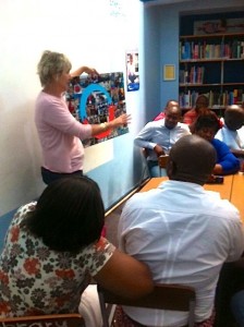 Louise presenting the photo collage of Recycle Swop Shop 2013